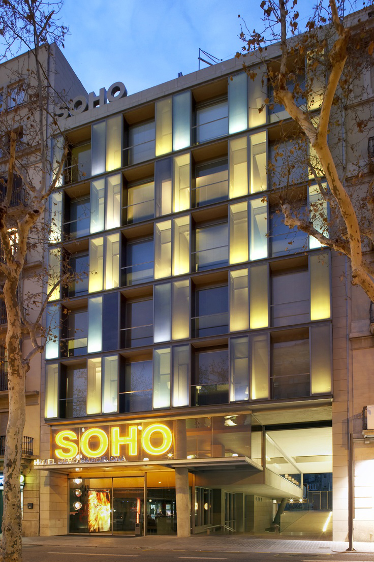 Facade of the hotel with illuminated windows