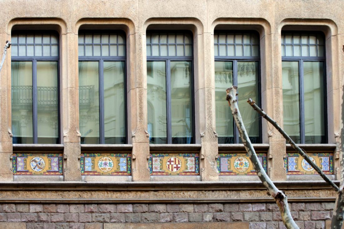 Metal windows in a stone facade
