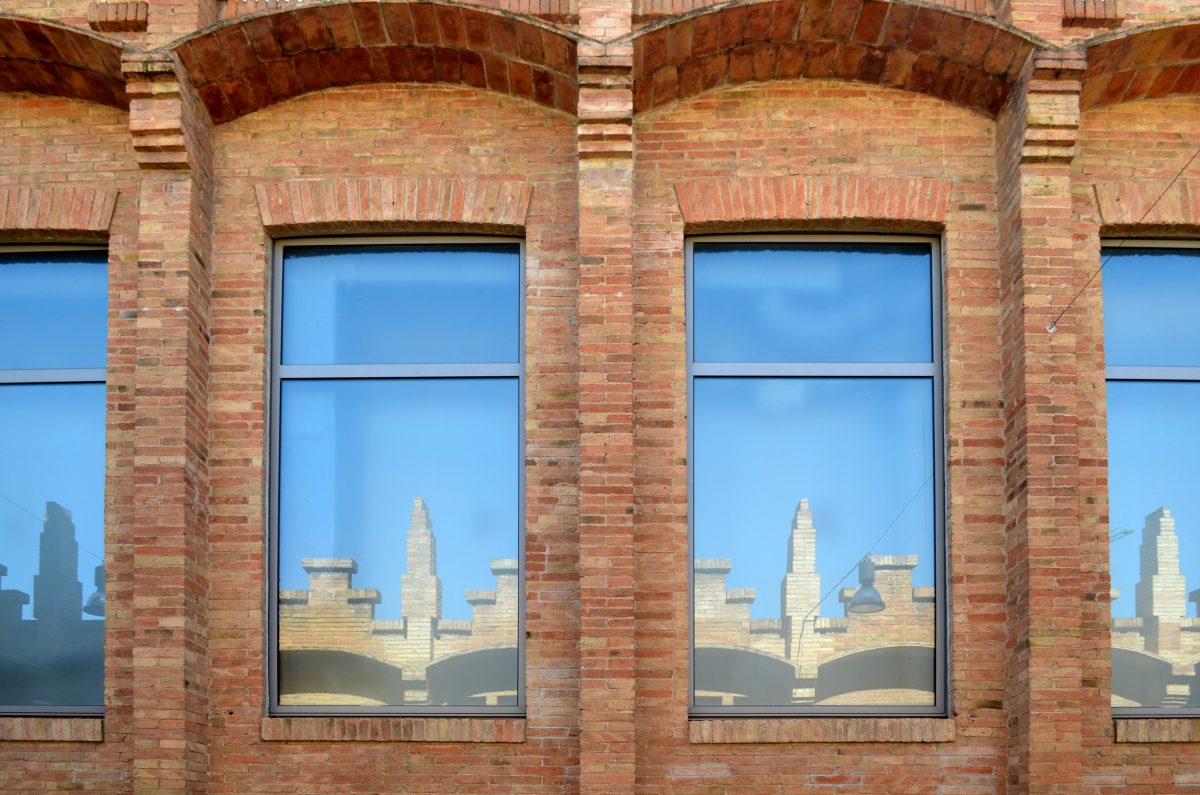 Metal windows in a brick wall