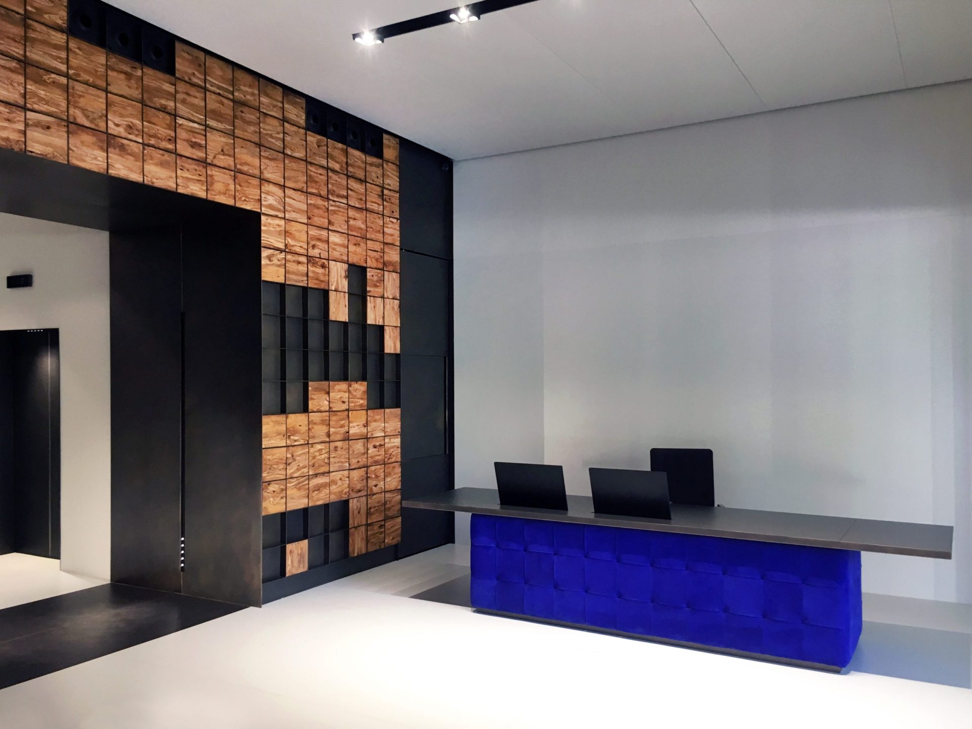 Lobby with metal wall and world map made of wooden squares