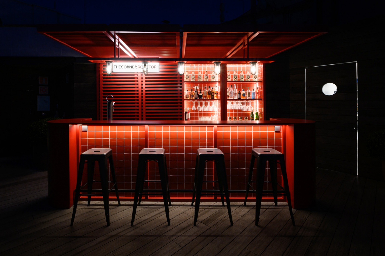 Rooftop bar with red metallic elements